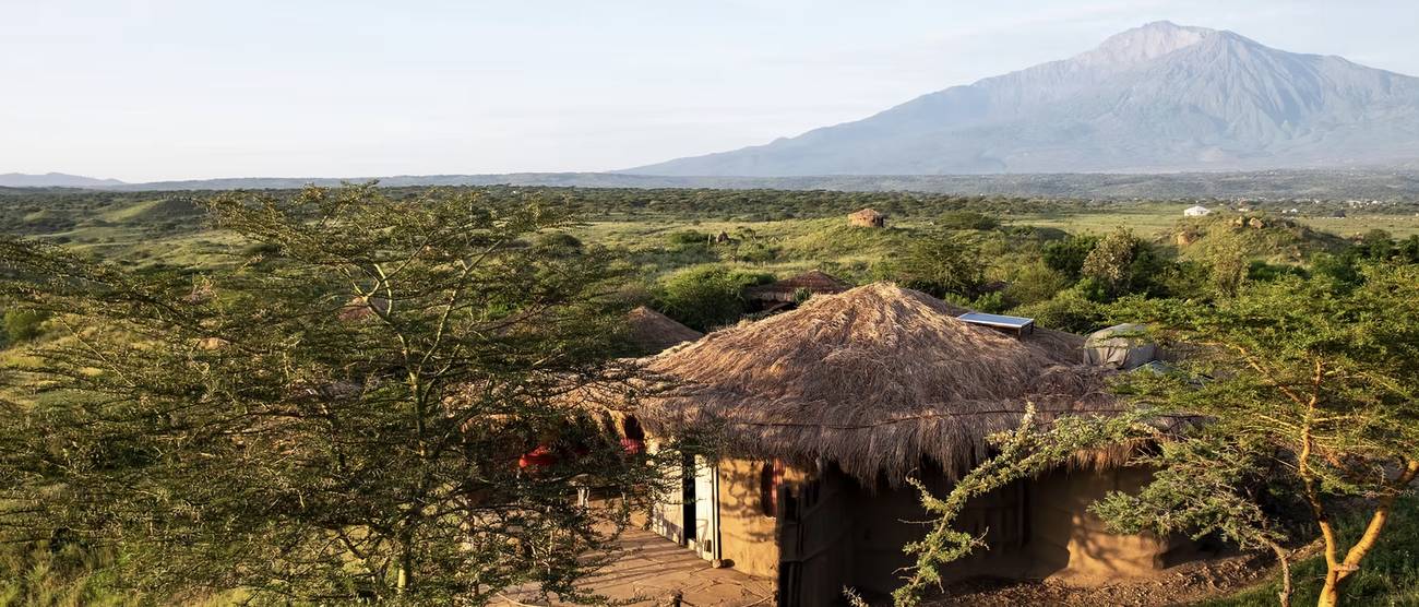 The lodge among acacias with Mount Meru behind
